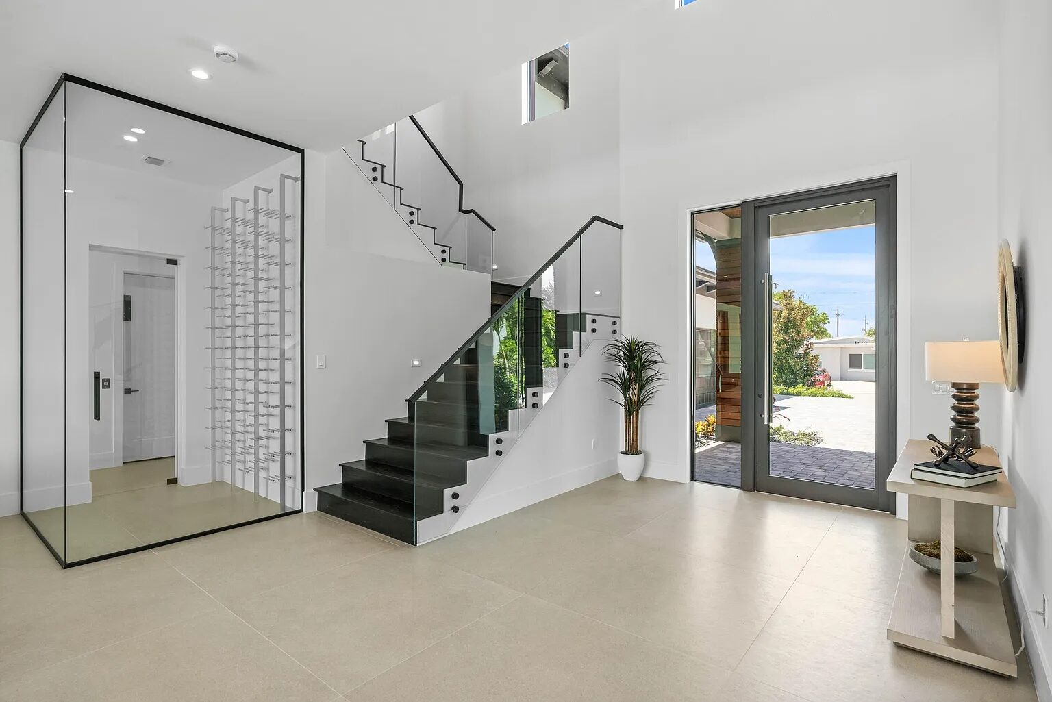 Interior glass systems — frameless wine cellar and glass stair railing