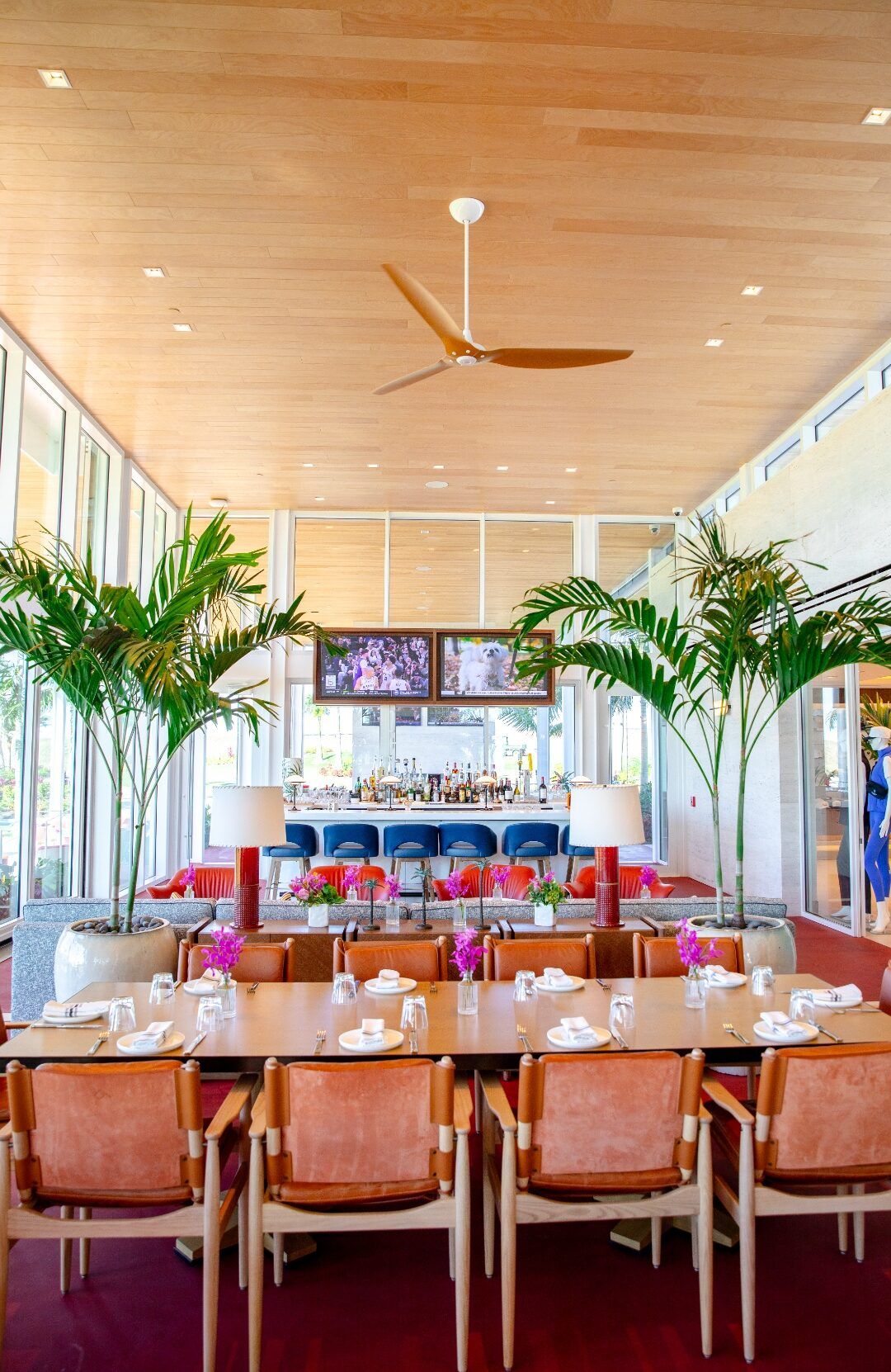 Atlantic Fields Golf House dining room interior with full glass wall surround