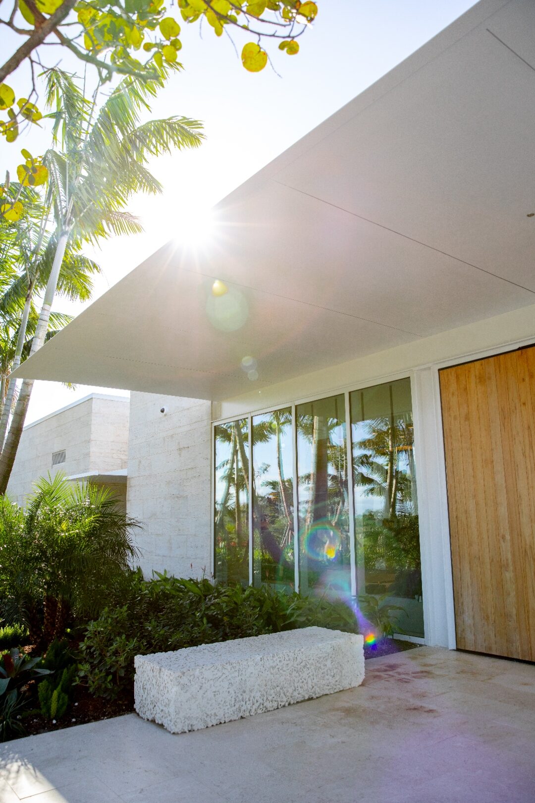 Glass sliding doors with wood accent wall