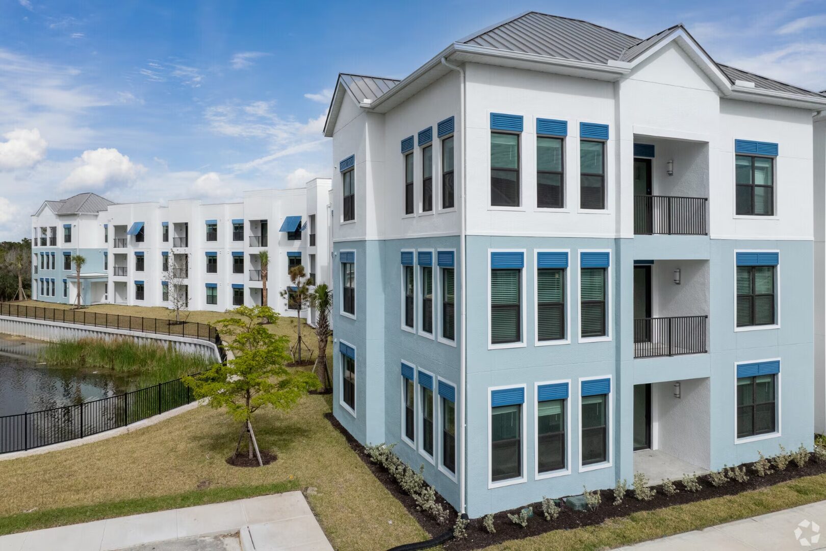 Imperial Crossings building at lake
