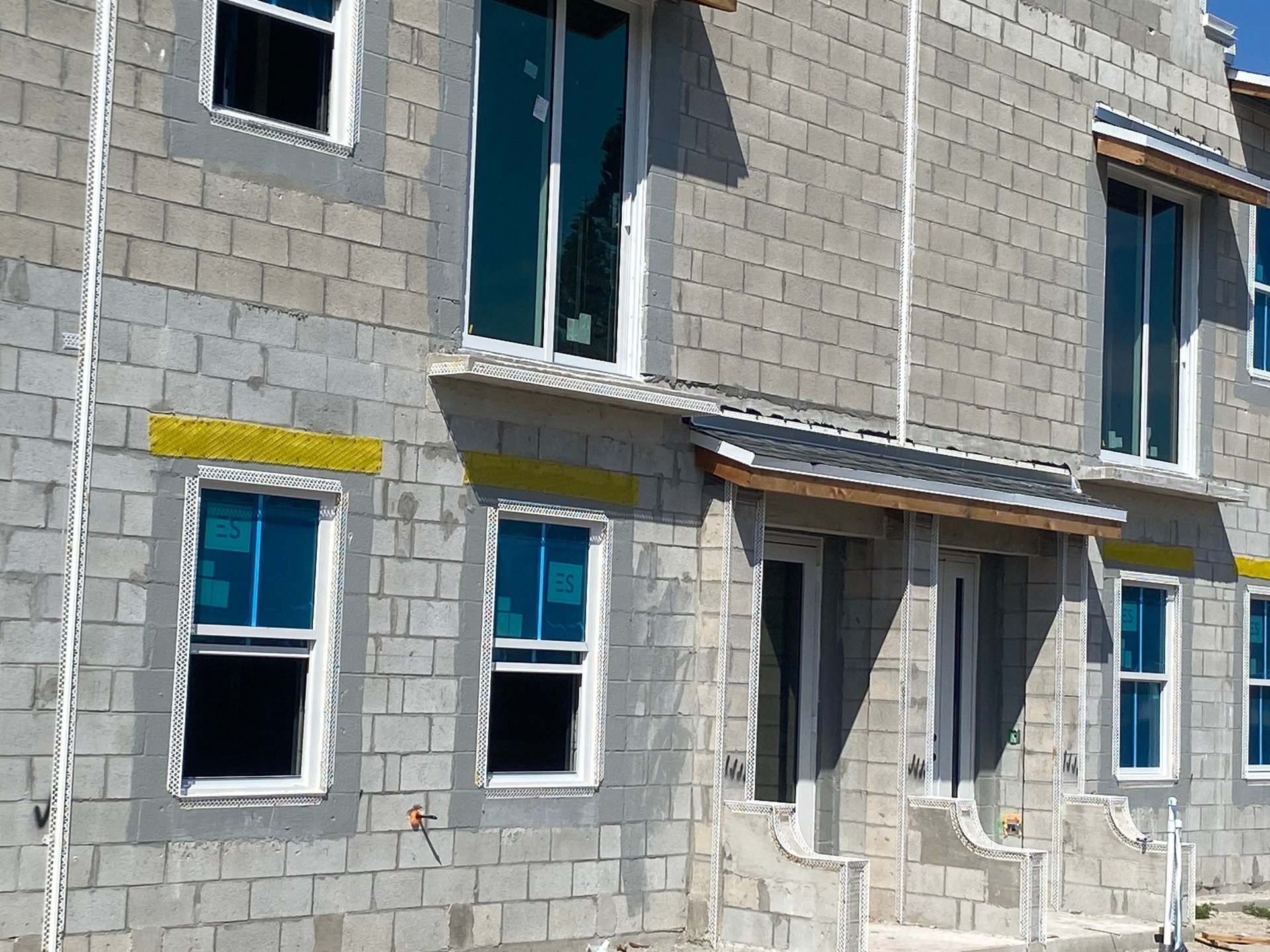 ES-SGD2020 impact-rated sliding glass door context — Villa L Onz townhomes, Riviera Beach