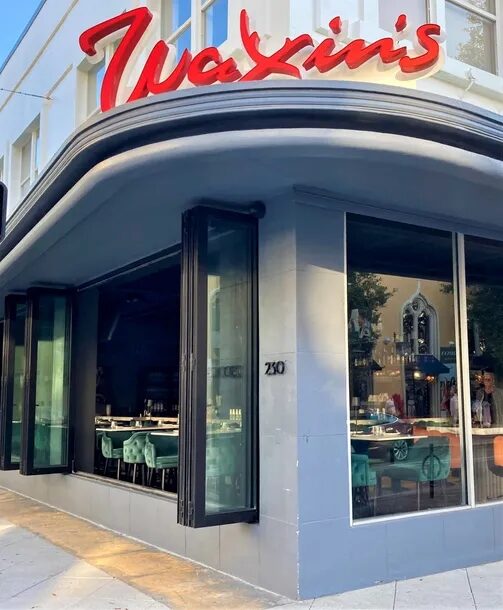 Waxin's West Palm Beach — Euro-Wall opening glass system on Clematis Street
